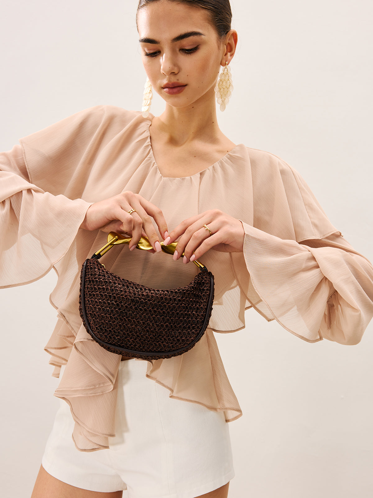 Woven Handbag With Twisted Gold Handle